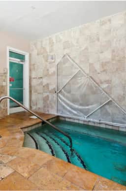 Renovated King Bed Condo near beach with pool access.